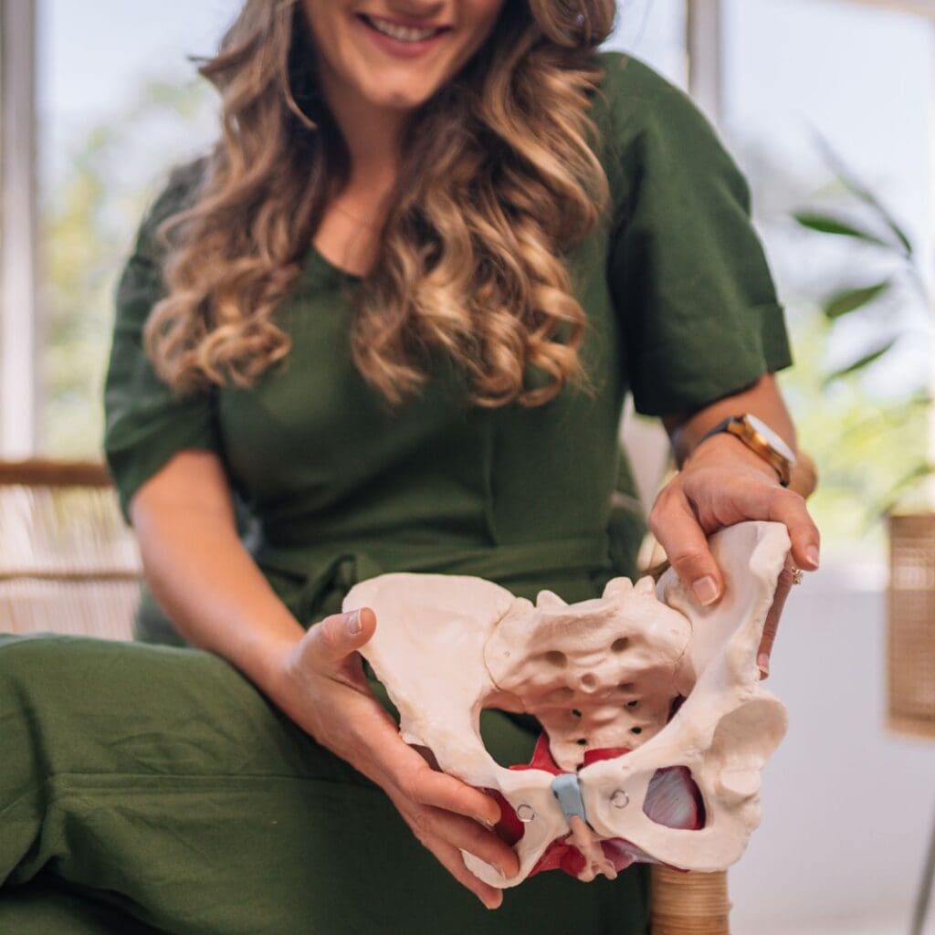 Candice Holding Pelvis